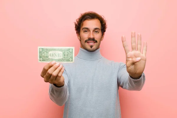 Joven Hombre Guapo Con Billetes Dólar Contra Pared Plana Rosa — Foto de Stock