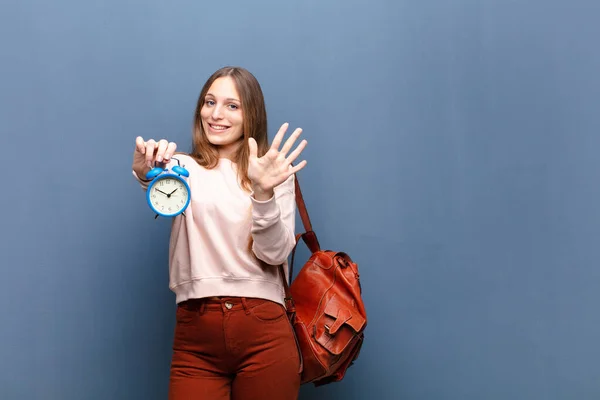 Young Pretty Woman Alarm Clock Blue Wall Copy Space — Stock Photo, Image