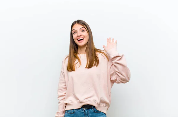 Young Pretty Woman Smiling Happily Cheerfully Waving Hand Welcoming Greeting — Stock Photo, Image