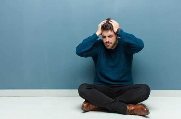 Young Handsome Man Sitting Floor Feeling Stressed Frustrated Raising Hands — Stock Photo, Image