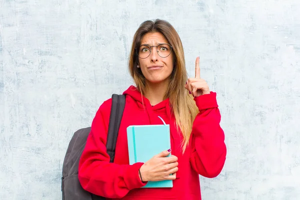 Young Pretty Student Feeling Genius Holding Finger Proudly Air Realizing — Stock Photo, Image