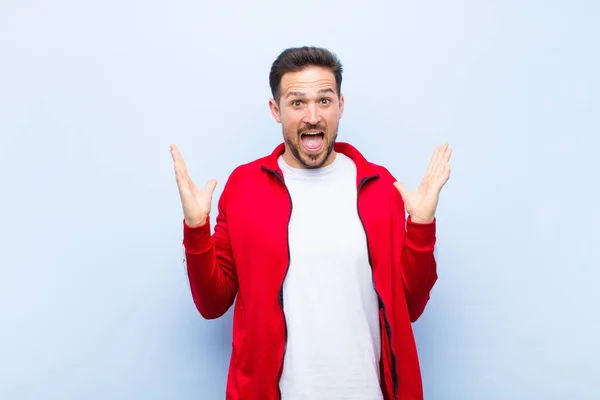 Young Handsome Sports Man Monitor Looking Happy Excited Shocked Unexpected — Stock Photo, Image