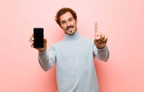 Young Handsome Man Smart Phone Pink Flat Wall — Stock Photo, Image