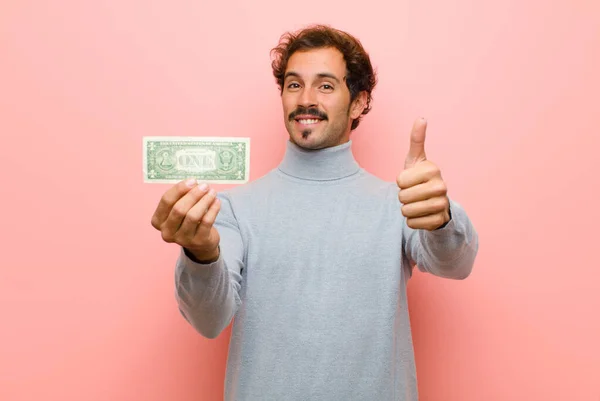 Joven Hombre Guapo Con Billetes Dólar Contra Pared Plana Rosa — Foto de Stock