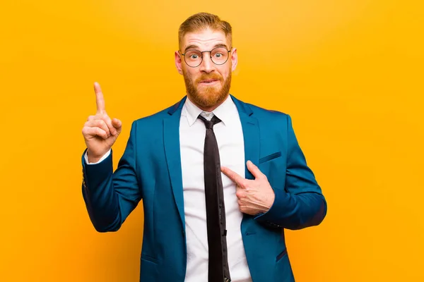 Young Red Head Businessman Feeling Proud Surprised Pointing Self Confidently — Stock Photo, Image