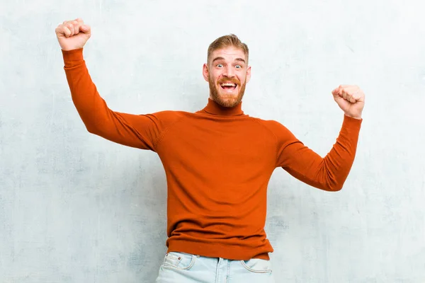 Young Red Head Man Wearing Turtle Neck Shouting Triumphantly Looking — Stock Photo, Image