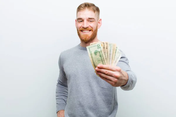 Jonge Rode Hoofd Man Met Dollars Tegen Witte Achtergrond — Stockfoto