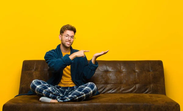 Young Man Wearing Pajamas Smiling Cheerfully Pointing Copy Space Palm — Stock Photo, Image