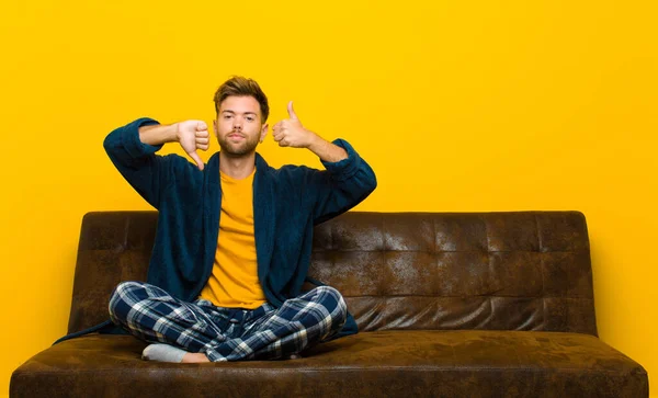 Young Man Wearing Pajamas Feeling Confused Clueless Unsure Weighting Good Stock Picture