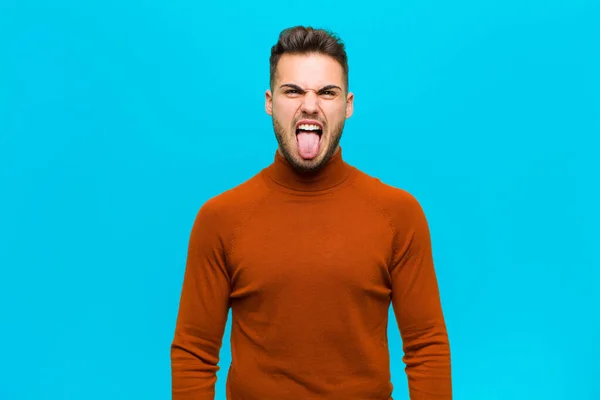 Young Hispanic Man Feeling Disgusted Irritated Sticking Tongue Out Disliking — ストック写真