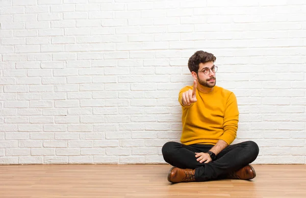 Young Handsome Man Sitting Home Floor Brick Wall Texture — Stock Photo, Image