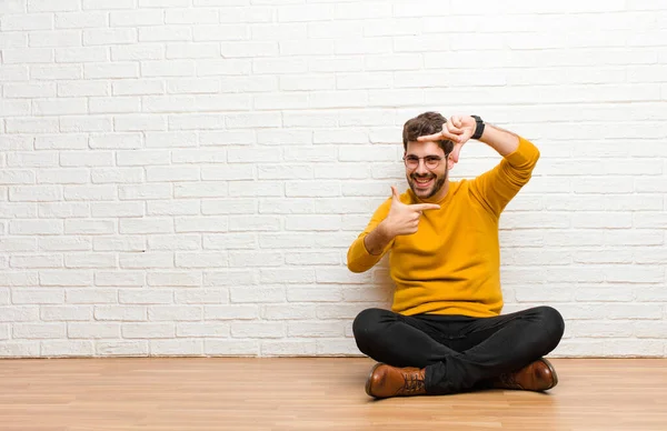 Young Handsome Man Sitting Home Floor Brick Wall Texture — Stock Photo, Image