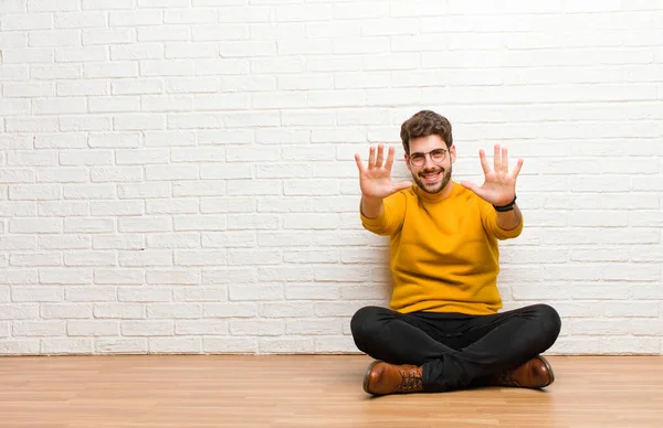 Young Handsome Man Sitting Home Floor Brick Wall Texture — Stock Photo, Image