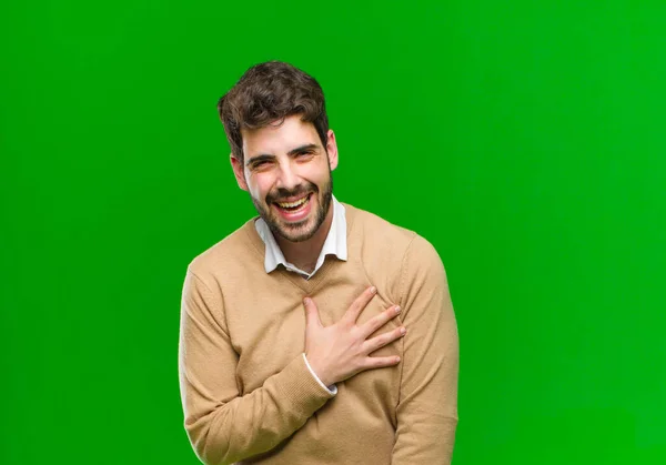 Joven Empresario Sintiéndose Sorprendido Sorprendido Sonriendo Tomando Mano Corazón Feliz —  Fotos de Stock