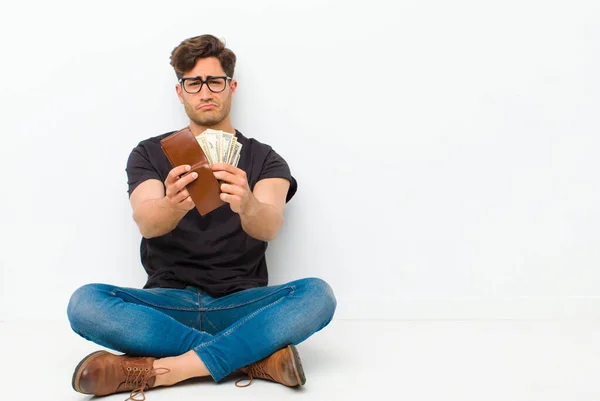 Young Handsome Man Wallet Sitting Floor Sitting Floor White Room — 스톡 사진