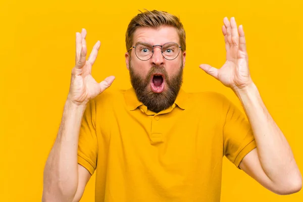 Young Blonde Man Screaming Hands Air Feeling Furious Frustrated Stressed — ストック写真