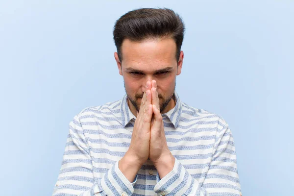 Young Handsome Man Feeling Worried Hopeful Religious Praying Faithfully Palms — Stock Photo, Image