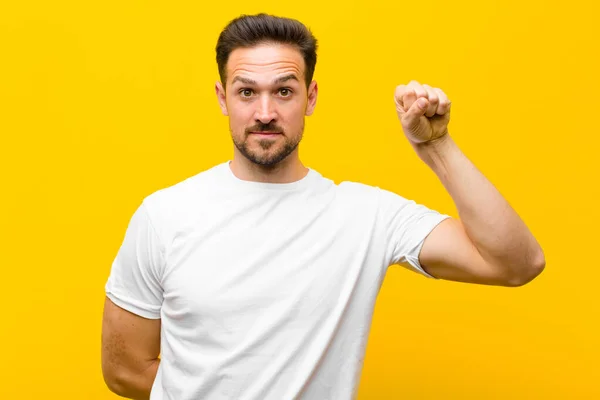 Young Handsome Man Feeling Serious Strong Rebellious Raising Fist Protesting — Stock Photo, Image