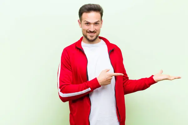 Young Handsome Sports Man Monitor Smiling Feeling Happy Carefree Satisfied — Stock Photo, Image