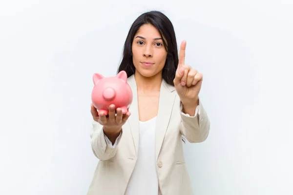 Young Hispanic Pretty Woman Piggy Bank — ストック写真