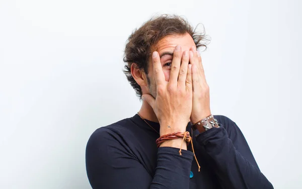 Young Handsome Man Covering Face Hands Peeking Fingers Surprised Expression — Stock Photo, Image