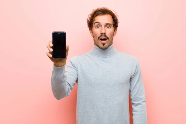 Young Handsome Man Smart Phone Pink Flat Wall — Stockfoto