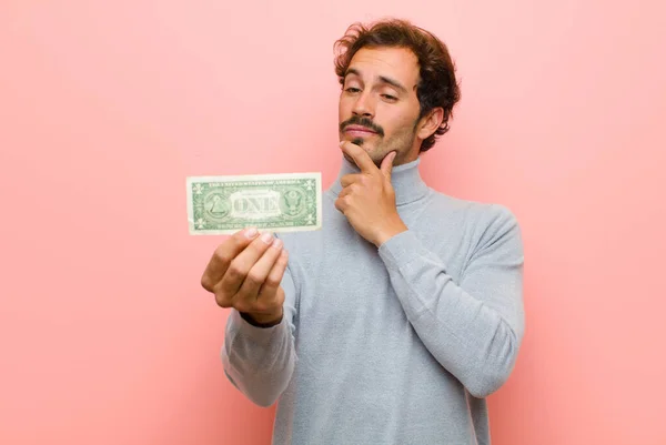 Joven Hombre Guapo Con Billetes Dólar Contra Pared Plana Rosa — Foto de Stock