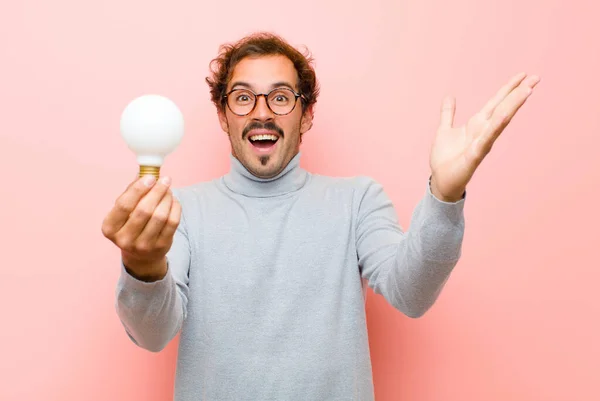 Young Handsome Man Having Idea Light Bulb Pink Flat Wall — Stock Photo, Image