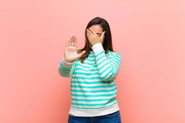 Young Pretty Hispanic Woman Covering Face Hand Putting Other Hand — Stockfoto