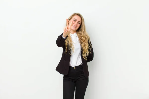 Young Blonde Woman Smiling Looking Happy Carefree Positive Gesturing Victory — Stock Photo, Image