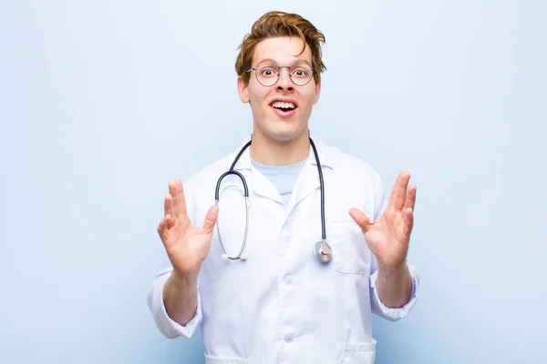 Young Red Head Doctor Looking Shocked Astonished Jaw Dropped Surprise — Stockfoto