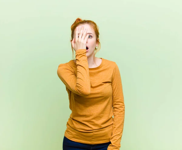 Young Pretty Red Head Woman Looking Shocked Scared Terrified Covering — Stockfoto