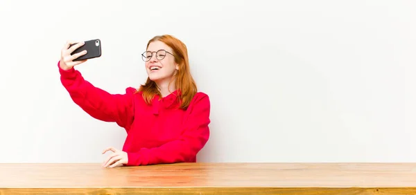 Young Red Head Pretty Woman Front Wooden Table Mobile Phone — Stock Photo, Image