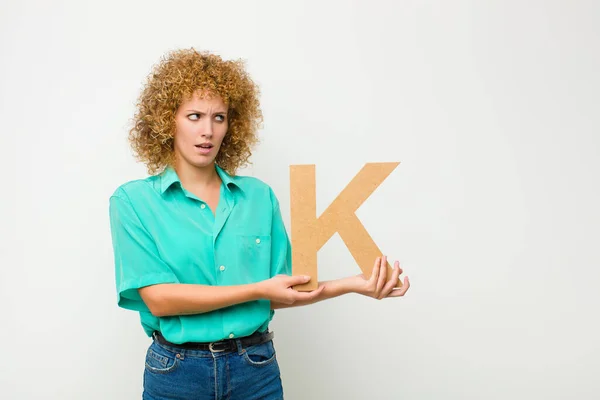 Young Pretty Afro Woman Surprised Shocked Amazed Holding Letter Alphabet — Stock Photo, Image