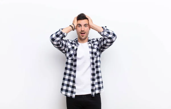 Young Handsome Man Raising Hands Head Open Mouthed Feeling Extremely — Stock Photo, Image
