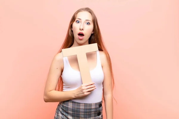 Yound Blonde Woman Surprised Shocked Amazed Holding Letter Alphabet Form — Stock Photo, Image