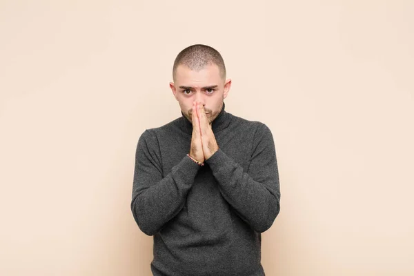 Young Handsome Man Feeling Worried Hopeful Religious Praying Faithfully Palms — Stock Photo, Image