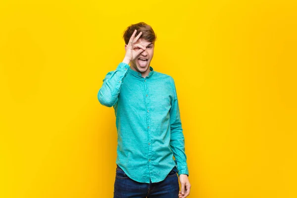 Young Blonde Man Smiling Happily Funny Face Joking Looking Peephole — Stock Photo, Image