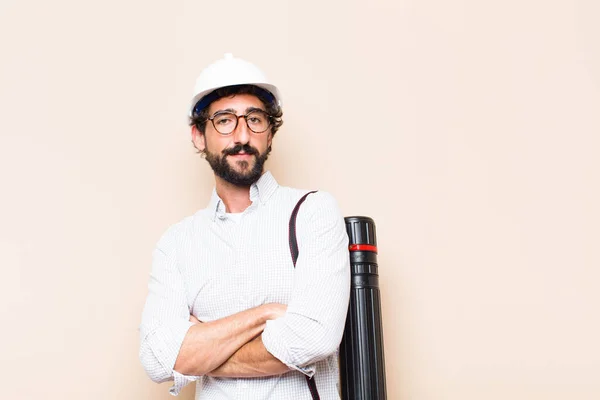 young  bearded architect man proud pose with a copy space