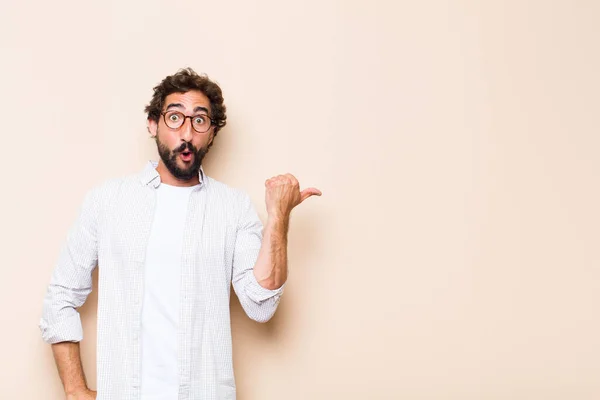 Young Cool Bearded Man Showing Pointing Side Royalty Free Stock Images