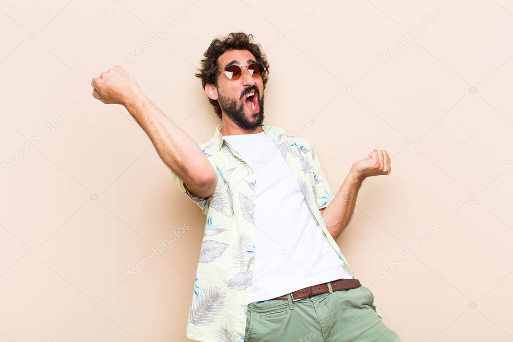 young cool bearded man dancing. holidays concept