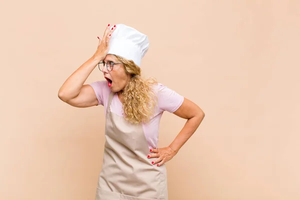 Middle Age Woman Baker Raising Palm Forehead Thinking Oops Making — ストック写真