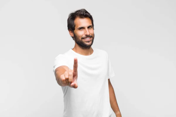 Young Latin Handsome Man Smiling Proudly Confidently Making Number One — Stock Photo, Image