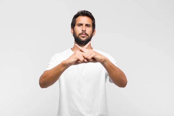 Young Latin Handsome Man Looking Serious Displeased Both Fingers Crossed — Stock Photo, Image