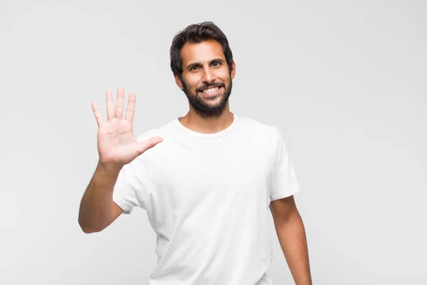 Young Latin Handsome Man Smiling Looking Friendly Showing Number Five — Stock Photo, Image