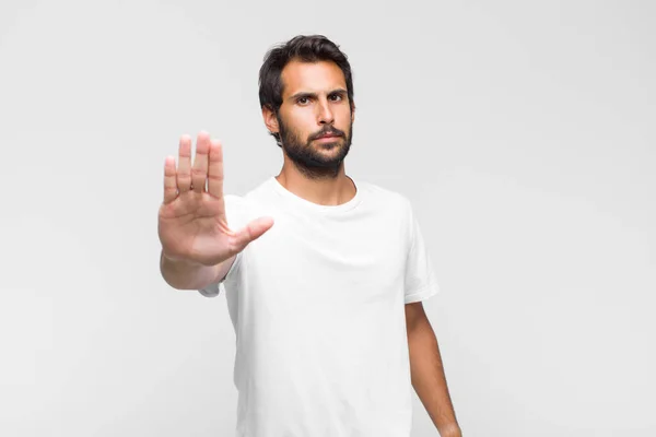 Young Latin Handsome Man Looking Serious Stern Displeased Angry Showing — Stock Photo, Image