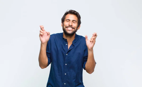 Young Latin Handsome Man Feeling Nervous Hopeful Crossing Fingers Praying — Stock Photo, Image