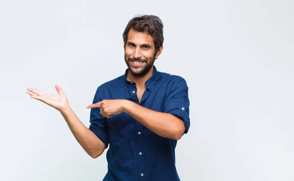 Young Latin Handsome Man Smiling Cheerfully Pointing Copy Space Palm — Stock Photo, Image