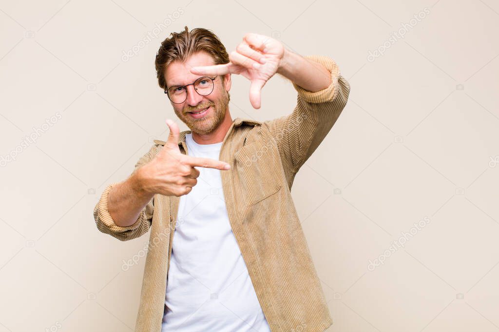 blonde adult caucasic man feeling happy and successful, smiling and clapping hands, saying congratulations with an applause