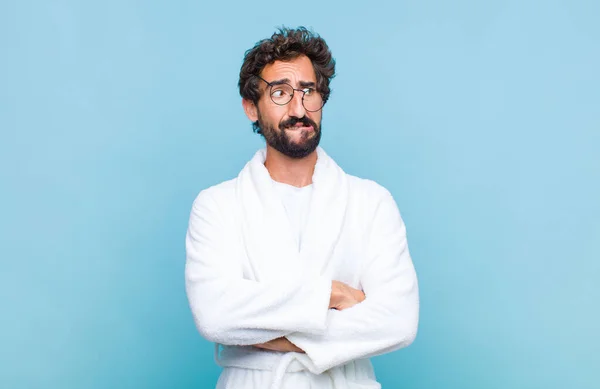 Young Bearded Man Wearing Bath Robe Doubting Thinking Biting Lip — Stock Photo, Image